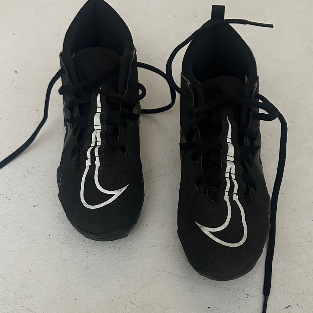 Nike Black cleats with Silver Swoosh